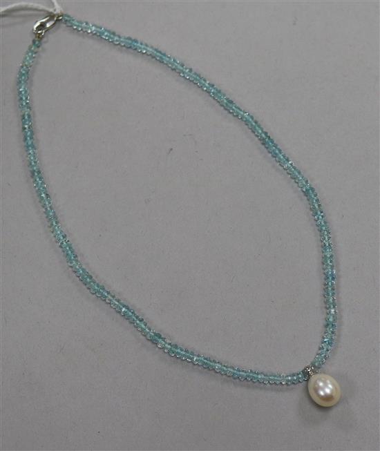 A single strand facetted aquamarine bead necklace, with freshwater pearl drop and 14ct white gold clasp, 35cm.